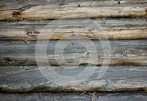 Gray brown old log wall, background with wood texture