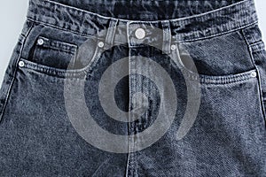 Gray buttoned jeans front view
