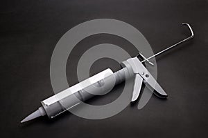 Gray caulk gun