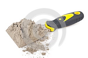 Gray cement powder with trowel