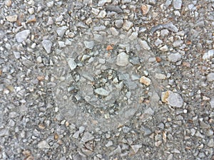 Gray cement wall with small stones