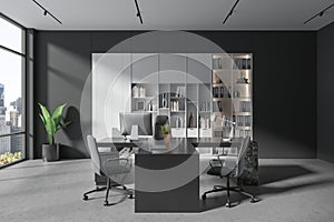 Gray CEO office with bookcase and table