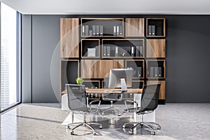 Gray ceo office interior, wooden bookcase