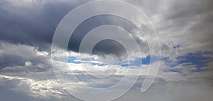 Gray clouds on blue sky background