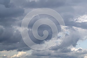 Gray clouds in rainy sky. Cortrast bright background