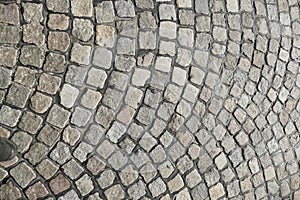 Gray cobblestone with curves, paving stones