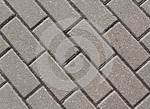 Gray color cobblestone pavement close-up