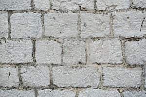 gray color of modern style design decorative uneven cracked real stone wall surface with cement