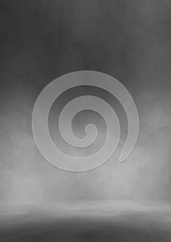 Gray color studio background grunge foggy texture with dark edges and light center black and white vertical design background