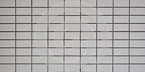 Gray concrete blocks wall abstract background