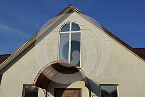 Gray concrete loft with one white window