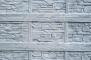 Gray concrete surface imitating wood and stone closeup
