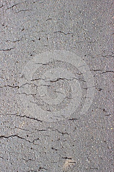 Gray cracked concrete asphalt bitumen background or texture.