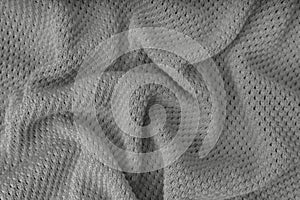 Gray crumpled knitting wool texture background.