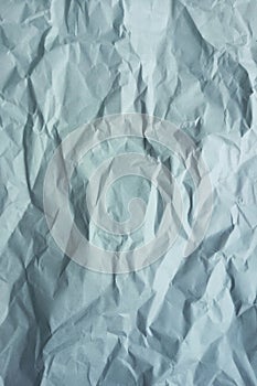 Gray crumpled a paper. Vertical photo. Background texture