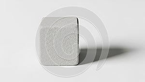 Cube casts a subtle shadow on the surface suggesting a light