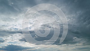 Gray cumulus rain dark clouds panoramic view. Massive dark rain storm clouds bg for weather forecast. Timelapse.