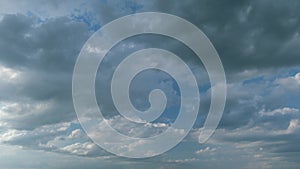 Gray cumulus rain dark clouds panoramic view. Massive dark rain storm clouds bg for weather forecast. Timelapse.