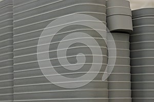 Gray dark plastic texture from a row of boxes