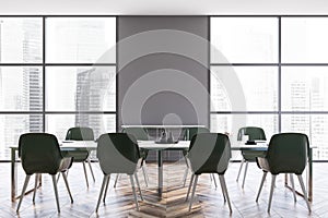 Gray dining room interior with green chairs