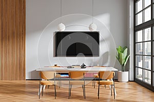 Gray dining room interior with TV