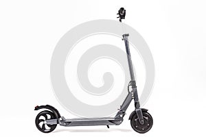 Gray electric scooter. Side view isolated on white.
