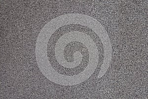 Grey exterior wall with pebbledash from the side