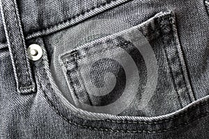 A gray fashion jeans denim front pocket details surface texture background close up