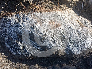 Gray fieldstone wall background pattern of stone