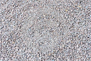 Gray fine stone texture of the soil. small black background made of road stone. road pebbles with a stone texture. dark background