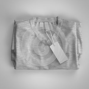 Gray folded T-shirt with labels. 3d rendering, mockup.
