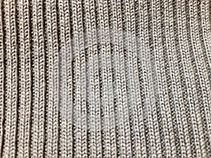 Gray fragment. Knitted, yarn. Background design, photography. Textile, fabric template, modern