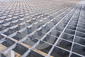 Gray galvanized iron grate, perspective view. Metal Flooring