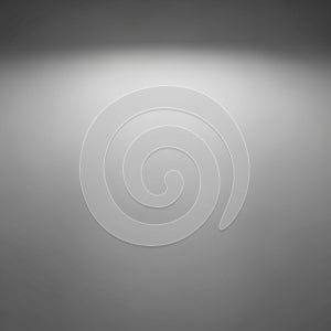 A gray gradient background with a spotlight effect focused at the center. The gradient
