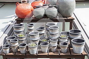 Gray, grained clay flower pots, shop window for gardening and growing potted plants and flowers. Capacity for flowers,flowerpot