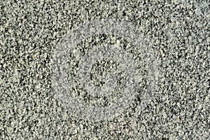Gray granite texture. Grained stone grunge background. Closeup