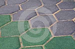 Gray and green cement block pavement