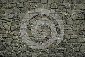 Gray green stone wall texture background. Rock texture. Green granite stone surface. Mosaic pattern of grey stones on the cement w