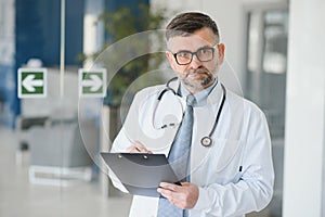 gray hair expertise handsome senior doctor hospital portrait