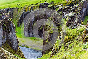 The gray-haired man photographs the canyon