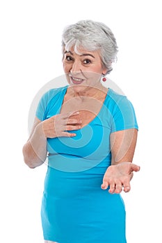 Gray-haired woman in turquoise explains something - isolated on photo