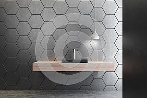 Gray honeycomb bathroom, black sink