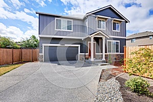 Gray house exterior with long driveway