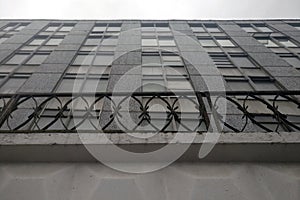 Gray industrial building with a fence. Greyness dull grey buildings in Moscow. Plain old build of the Soviet era