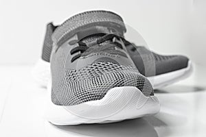 Gray kids sports sneakers on a white background