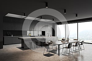 Gray kitchen corner with island and dining table