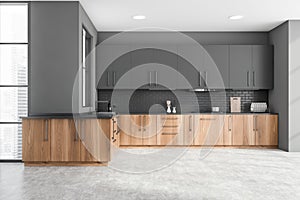 Gray kitchen interior with wooden counters