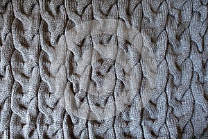 Gray knitted fabric with plait pattern from above