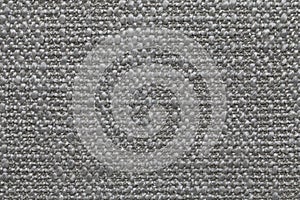 Gray knitted woolen background with a pattern of soft, fleecy cloth. Texture of textile closeup