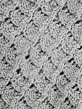 Gray Knitting pattern close-up. Knitting is an easy pattern for beginners